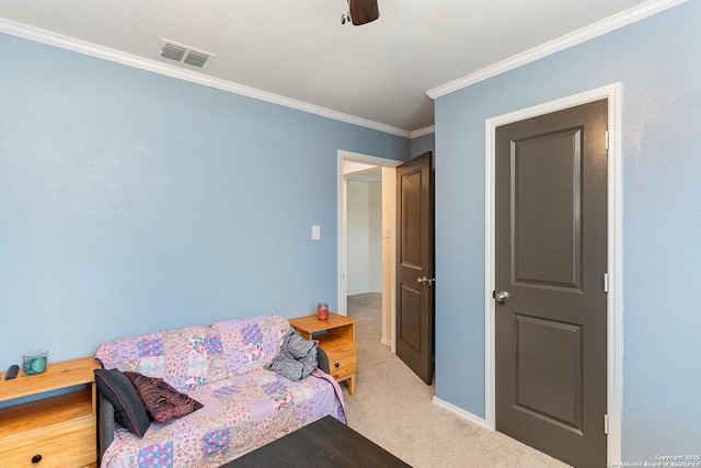 bedroom featuring crown molding, carpet, and ceiling fan