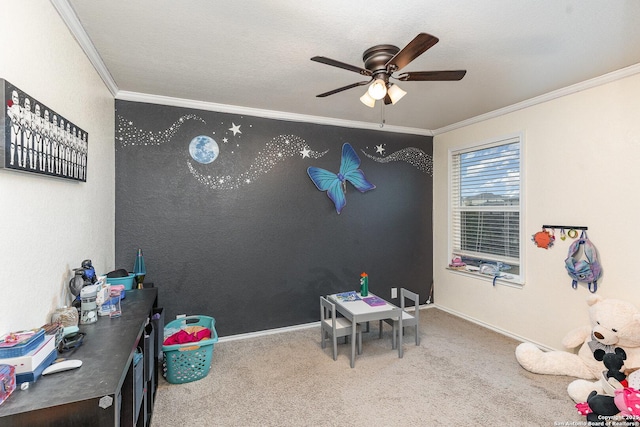 rec room featuring ornamental molding, carpet floors, and ceiling fan