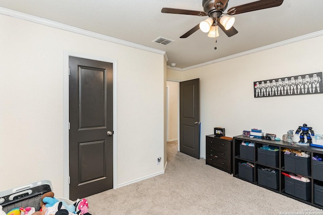 interior space with ornamental molding, light colored carpet, and ceiling fan