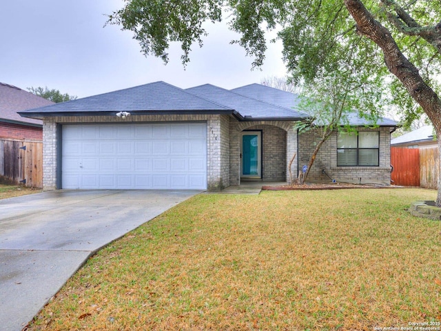 ranch-style home featuring a garage and a front lawn