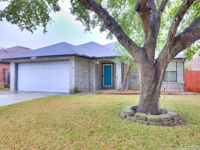 ranch-style house with a garage and a front lawn