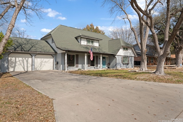 view of front facade featuring a garage and covered porch