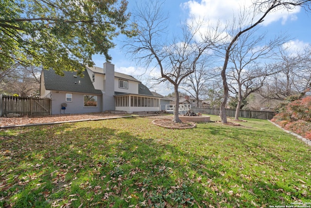 view of yard with a sunroom