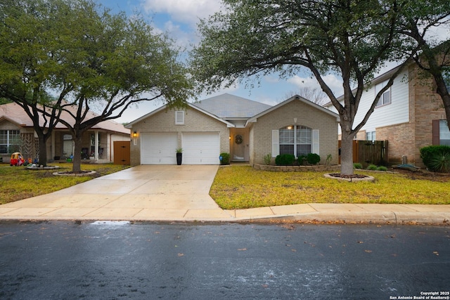 view of front facade with a garage and a front lawn