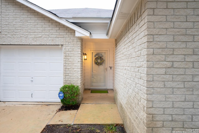 entrance to property featuring a garage