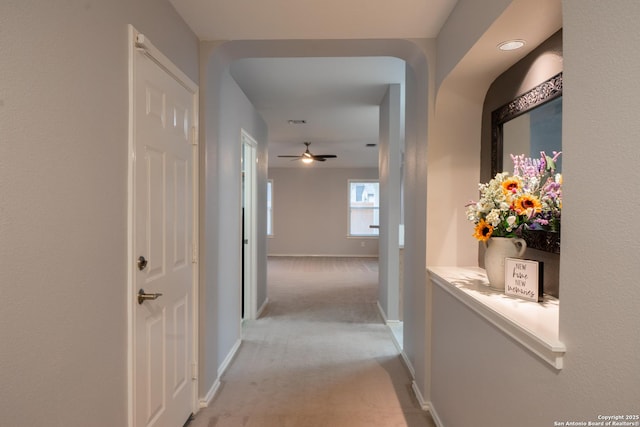 hallway with light carpet