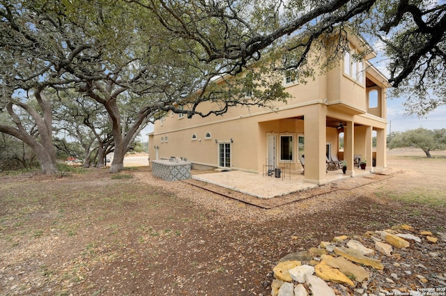 rear view of property featuring a patio area