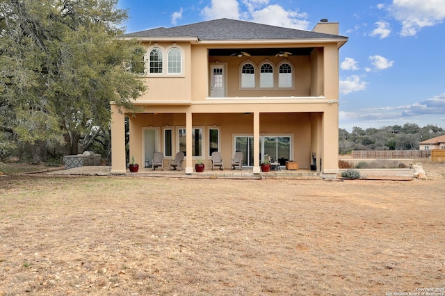 rear view of house with a patio and ceiling fan