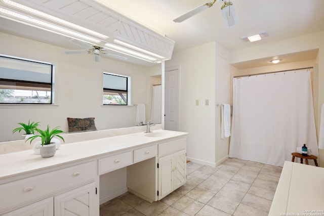 bathroom featuring tile patterned floors, ceiling fan, and vanity