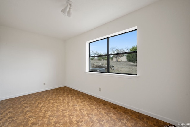 empty room with baseboards