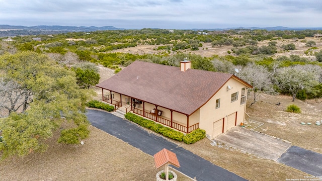 birds eye view of property featuring a mountain view