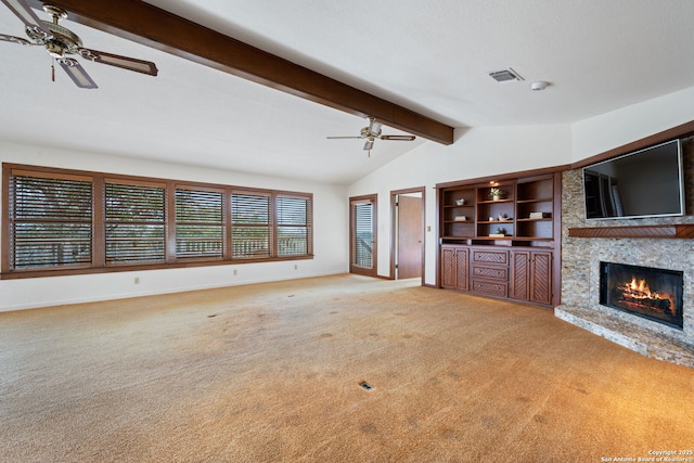 unfurnished living room featuring carpet, a fireplace, visible vents, lofted ceiling with beams, and ceiling fan