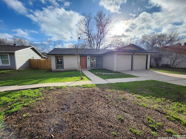 view of front facade with an attached garage, brick siding, fence, driveway, and a front lawn