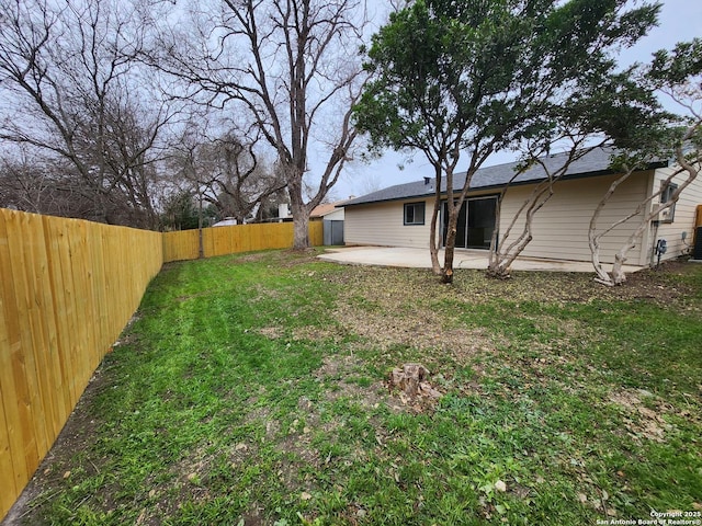 view of yard with a patio area and a fenced backyard