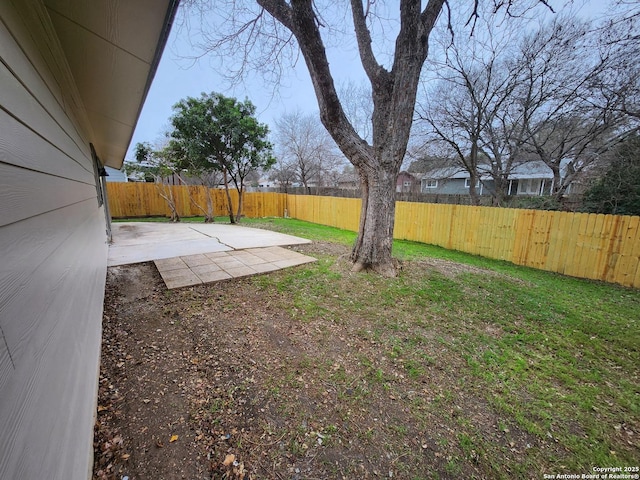 view of yard with a fenced backyard and a patio