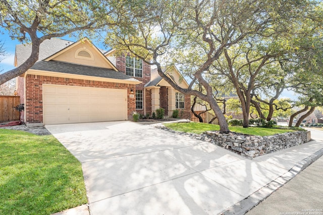 view of front of home with a garage and a front lawn