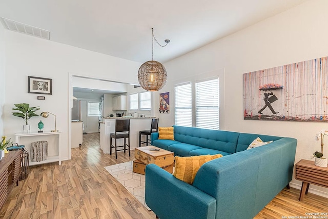 living room with light hardwood / wood-style flooring