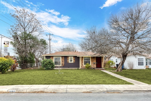 ranch-style house with a front yard