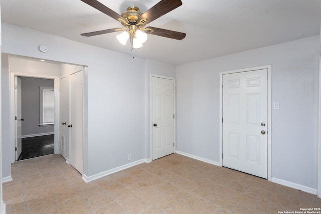 unfurnished bedroom featuring ceiling fan