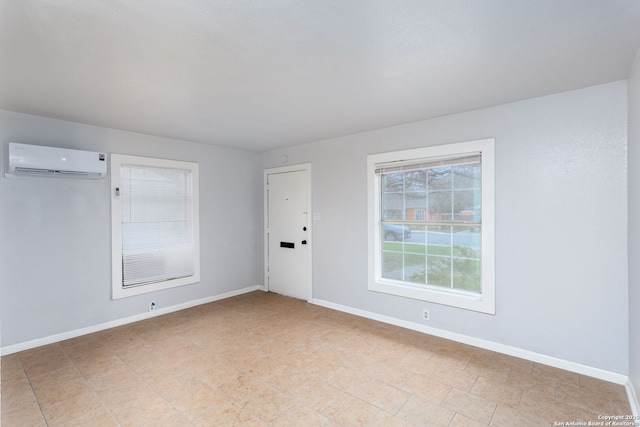 empty room featuring an AC wall unit