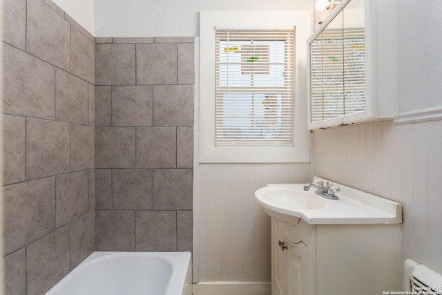 bathroom featuring vanity and a bathtub