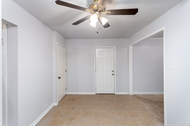 unfurnished room featuring ceiling fan