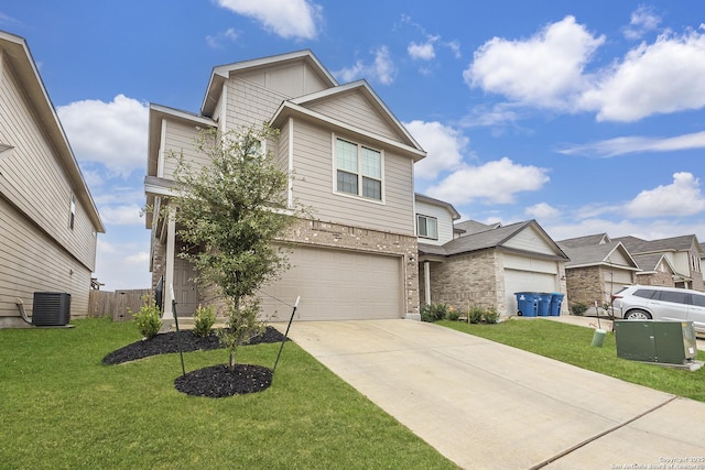 view of front of property featuring a garage, central AC, and a front lawn