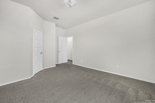 unfurnished bedroom featuring dark colored carpet