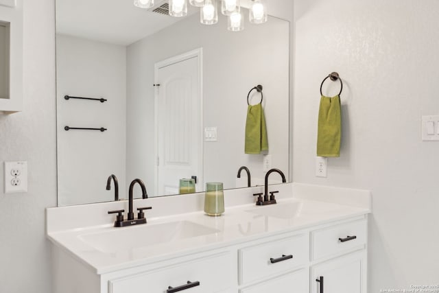 bathroom featuring double vanity and a sink