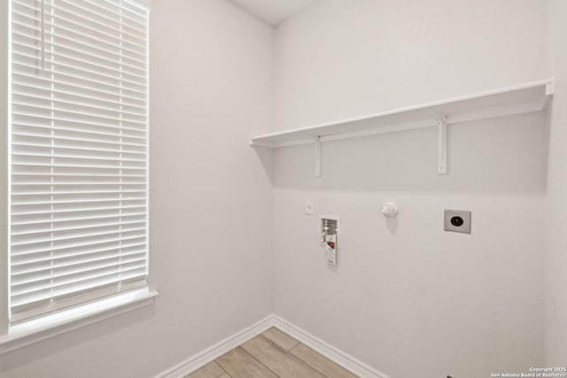 laundry room featuring laundry area, baseboards, wood finished floors, hookup for a washing machine, and electric dryer hookup