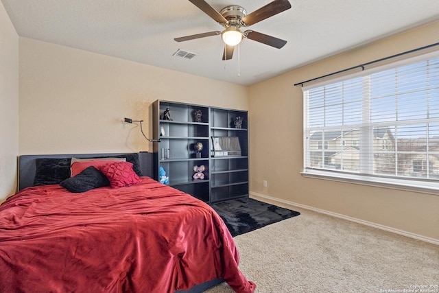 bedroom with ceiling fan and carpet flooring