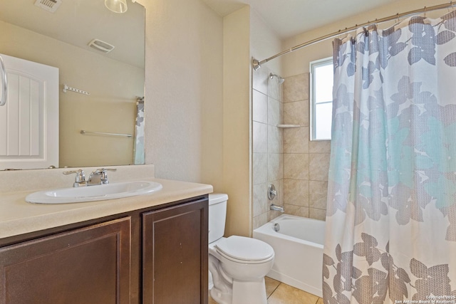 full bathroom with shower / bath combination with curtain, tile patterned floors, toilet, and vanity