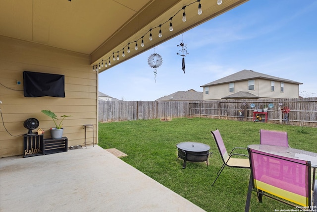 view of yard with a patio and a fire pit