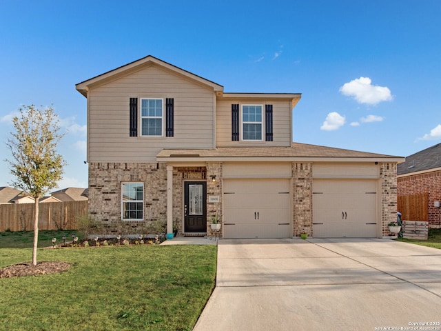 view of front property with a garage and a front yard