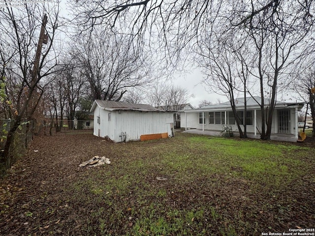 back of house with a yard