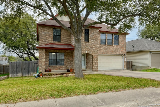 view of front property featuring a garage and a front lawn