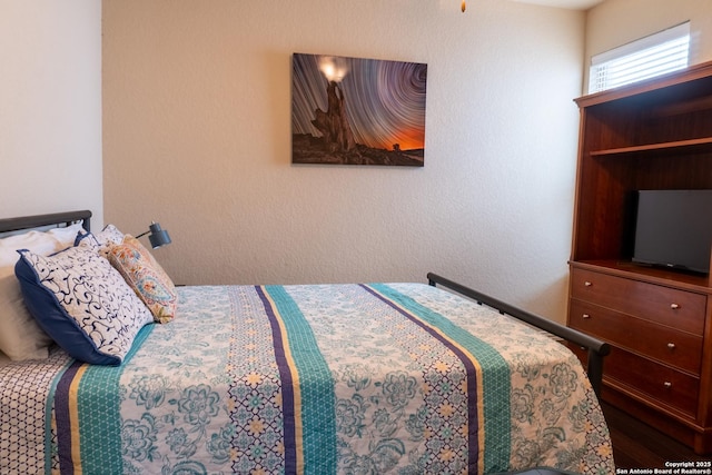 bedroom featuring hardwood / wood-style floors