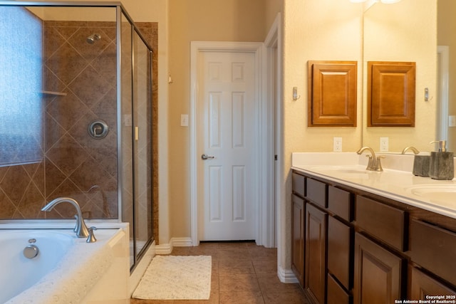 bathroom with vanity, tile patterned floors, and separate shower and tub