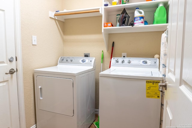 clothes washing area featuring washing machine and dryer