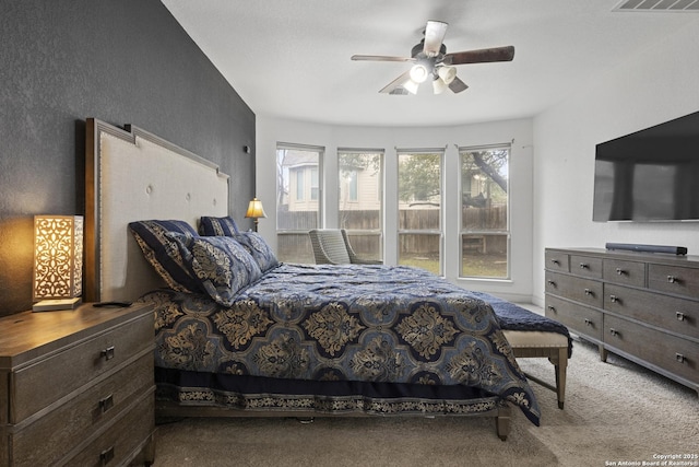 carpeted bedroom featuring ceiling fan