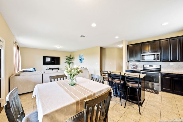 dining area with light tile patterned flooring