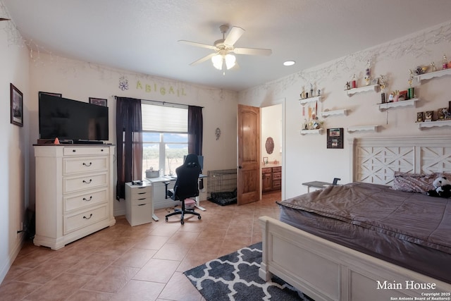 tiled bedroom featuring ceiling fan and ensuite bathroom