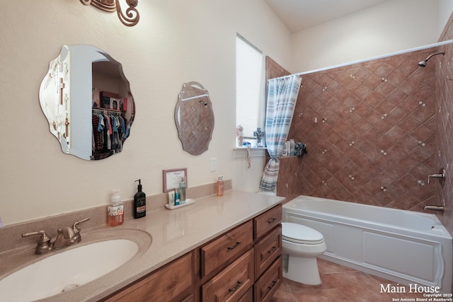 full bathroom with tile patterned floors, vanity, toilet, and shower / bath combo