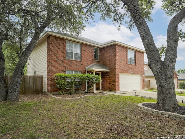 view of front of home featuring a garage and a front yard