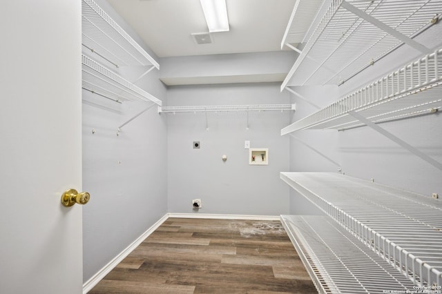 washroom featuring washer hookup, hardwood / wood-style floors, hookup for a gas dryer, and hookup for an electric dryer