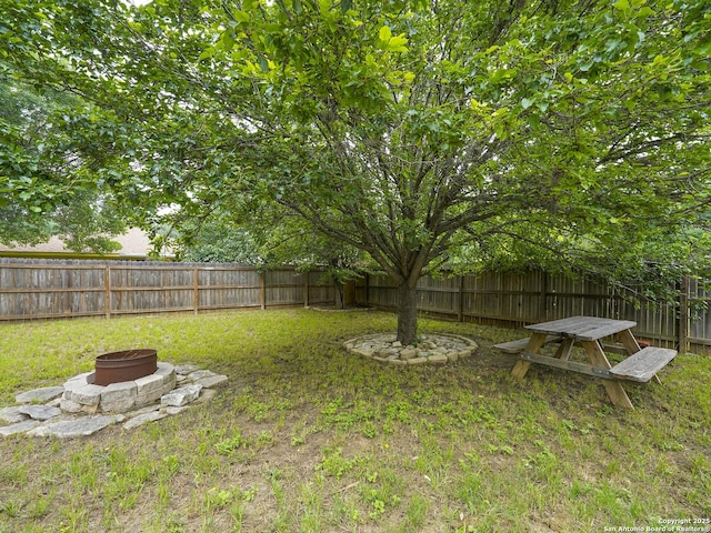 view of yard with an outdoor fire pit