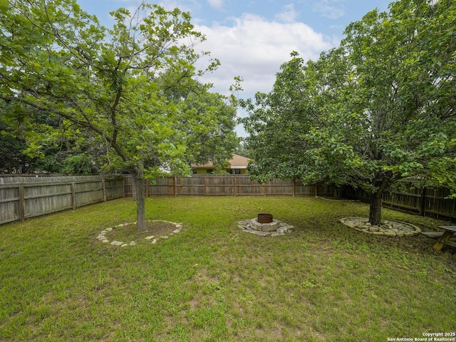 11723 Shotgun Way, Helotes, TX 78023 - view of yard featuring a fenced backyard and an outdoor fire pit