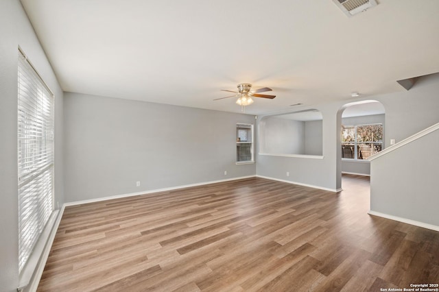 unfurnished room with ceiling fan and light hardwood / wood-style floors