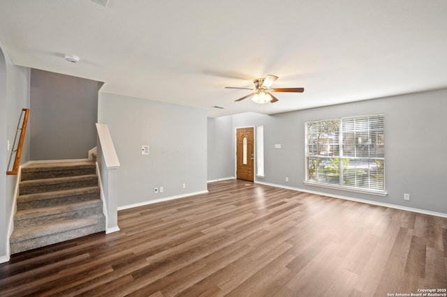 unfurnished living room with hardwood / wood-style flooring and ceiling fan