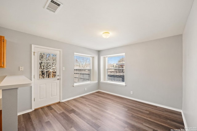 unfurnished dining area with hardwood / wood-style flooring